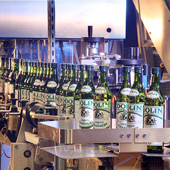 Dolin Dry Vermouth Bottles In Machine