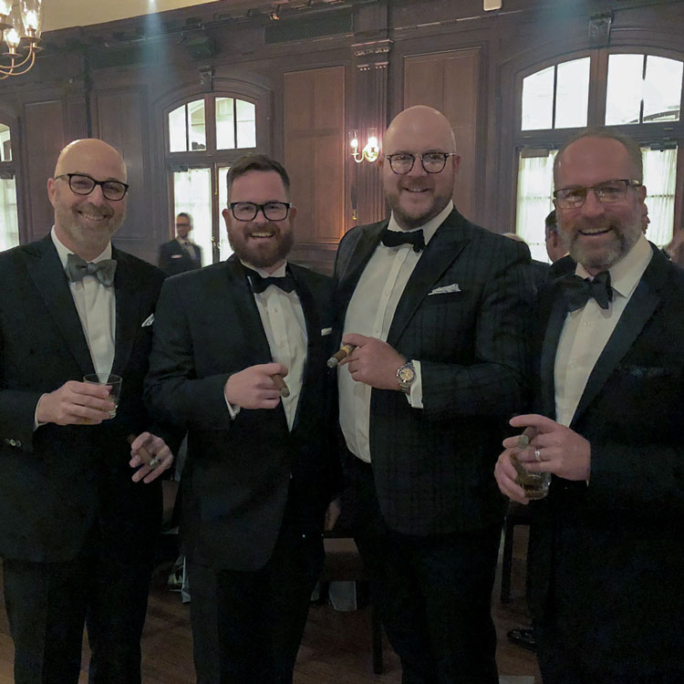 Men In Tuxedos Smoking Cigars