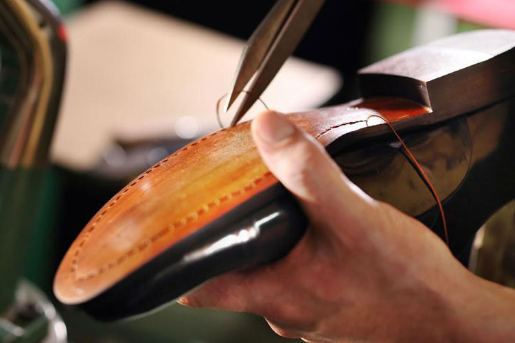 Carlos Santana Shoes Being Stitched