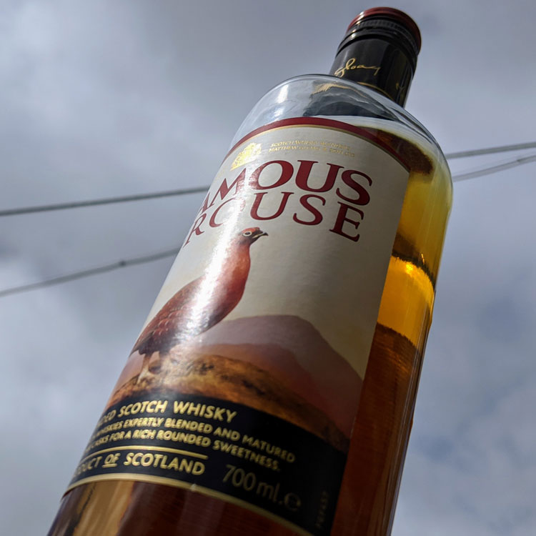 The Famous Grouse Whisky Bottle Sky Background