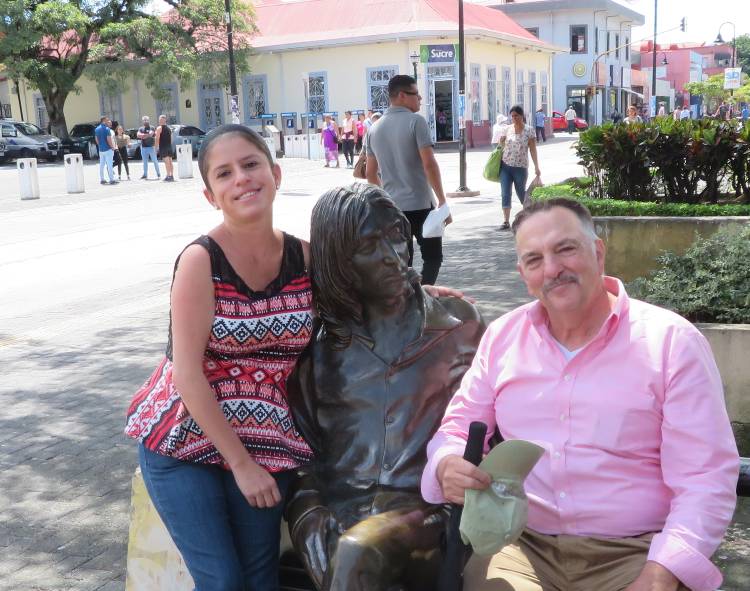 Nury and Michael Miller with Statue of John Lennon