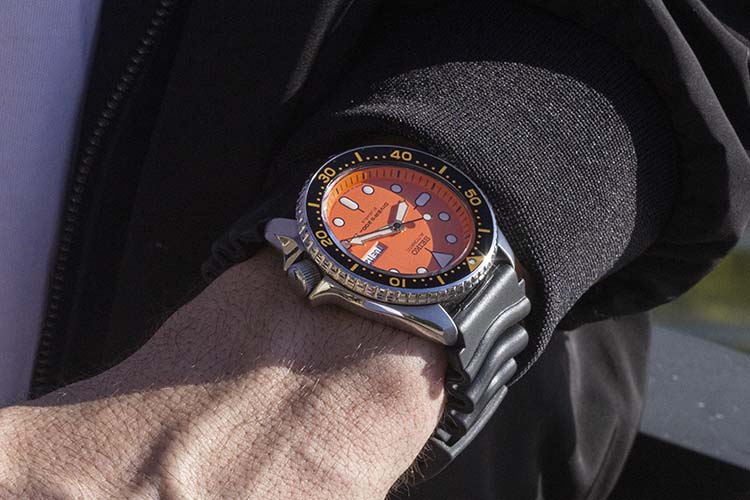 Wristie Of Seiko SKX011J With Black Bomber Jacket