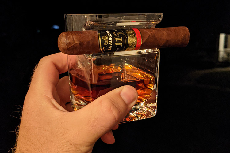 La Aurora Cigar With Rum Glass In Hand 2
