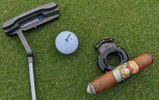 Xikar XO Cutter being used a cigar rest on golf course