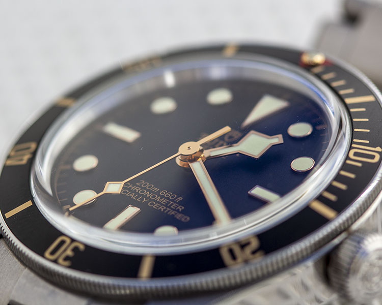 Rose Gold Snowflake Hands Against Black Dial Of Tudor 79030