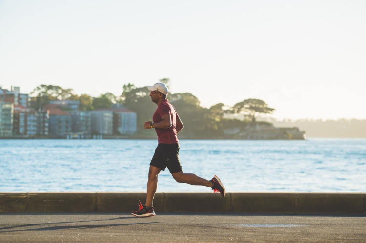 Man Running During Morning NExt To Ocean
