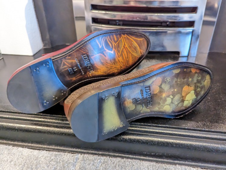 Art Patterns On Leather Soles Of Idrese Boots