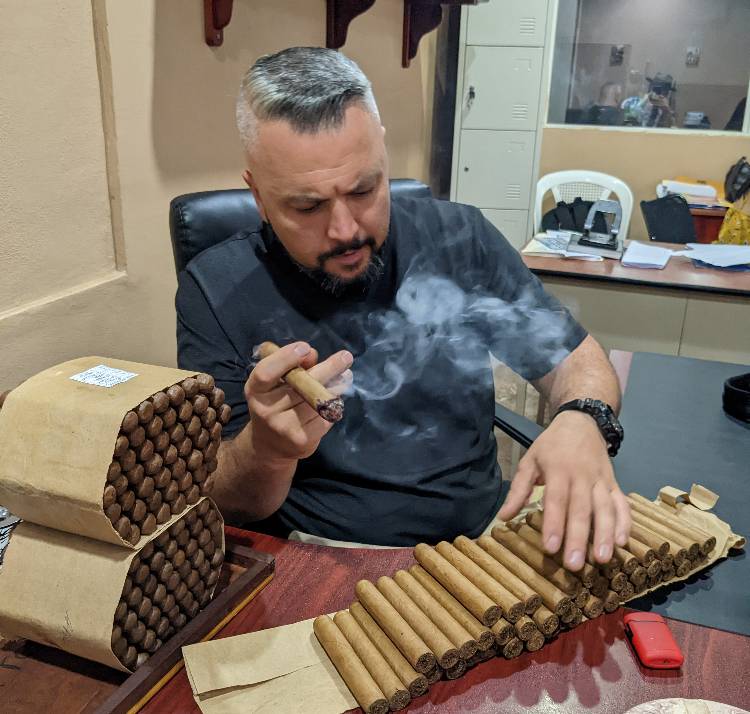 Andrius Inspecting Cigars