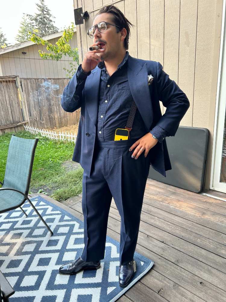Wearing STRO Suit With Suspenders While Smoking Cigar