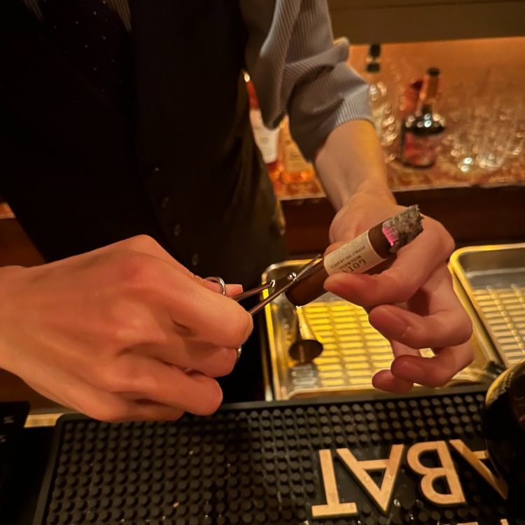 Cutting Band Of Cigar With Small Scissors