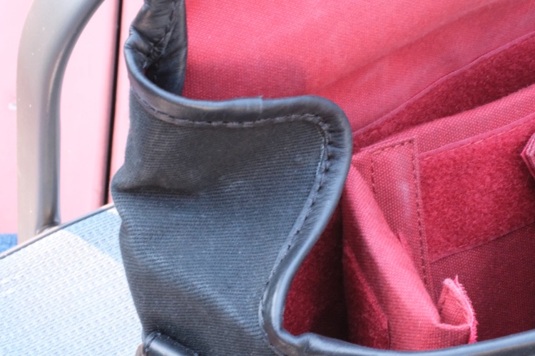 Leather Accents contrasting With Black waxed Twill Fabric